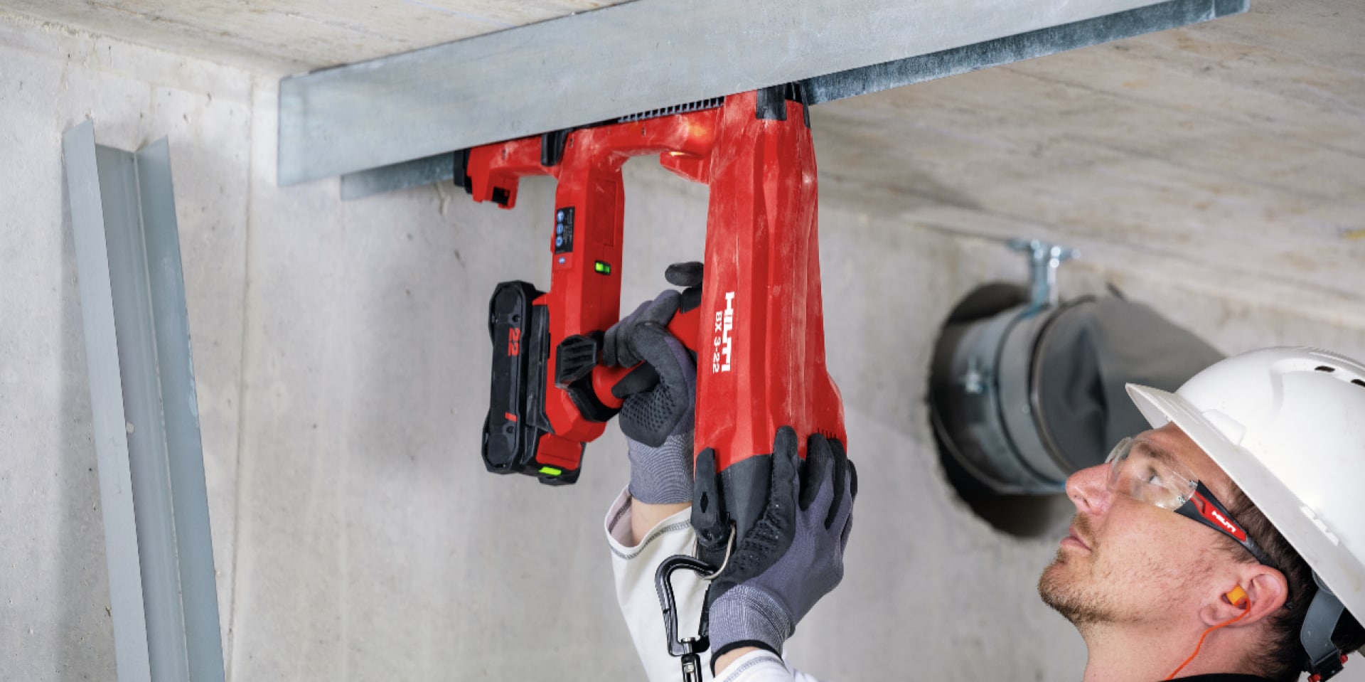BX 3 battery-powered nailer, a virtually dust-free alternative to drilling, being used to fasten on concrete