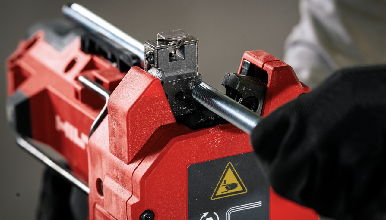 jobsite worker using rod cutter