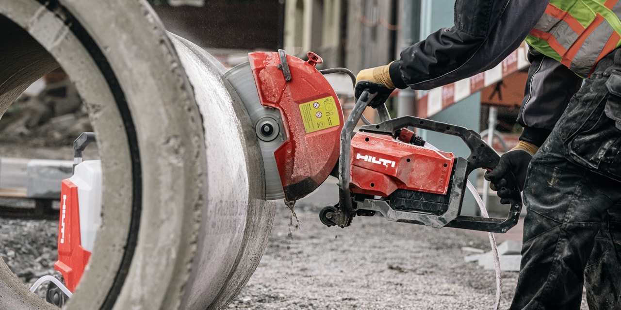 man using red hilti cut off saw
